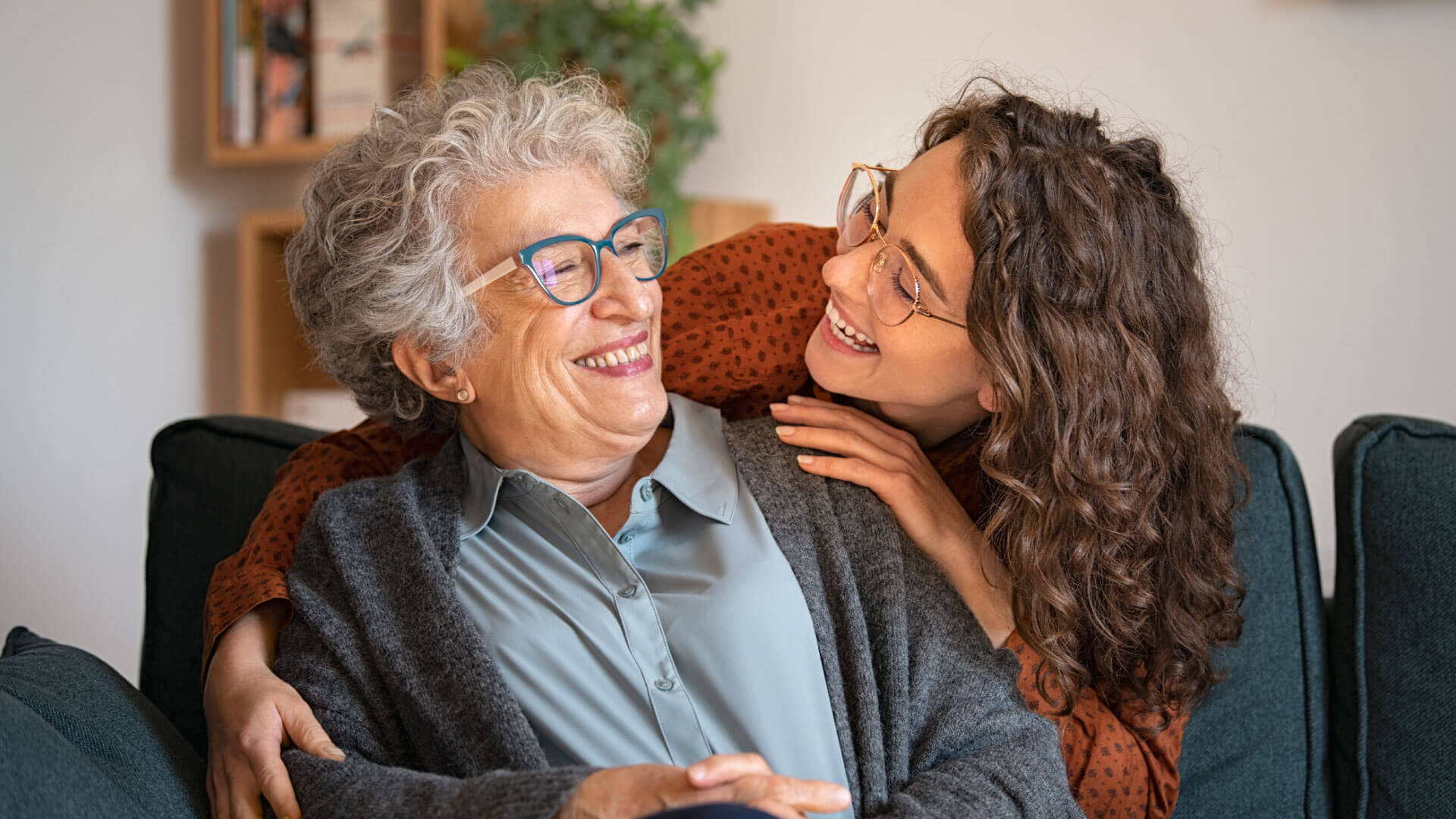 senior laughing with her granddaughter